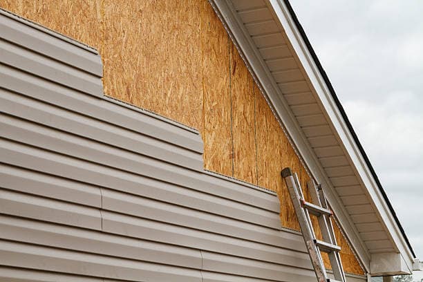 Contractor performing siding repair in North Carolina